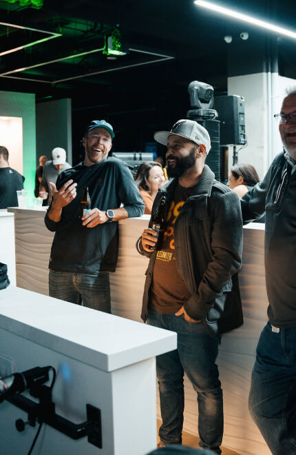 Guests enjoying drinks and conversation at the Studio Golf lounge area.